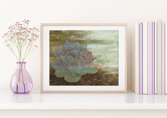 Framed succulent art print by Sarah Terrell styled on a white shelf with books and a lavender vase.