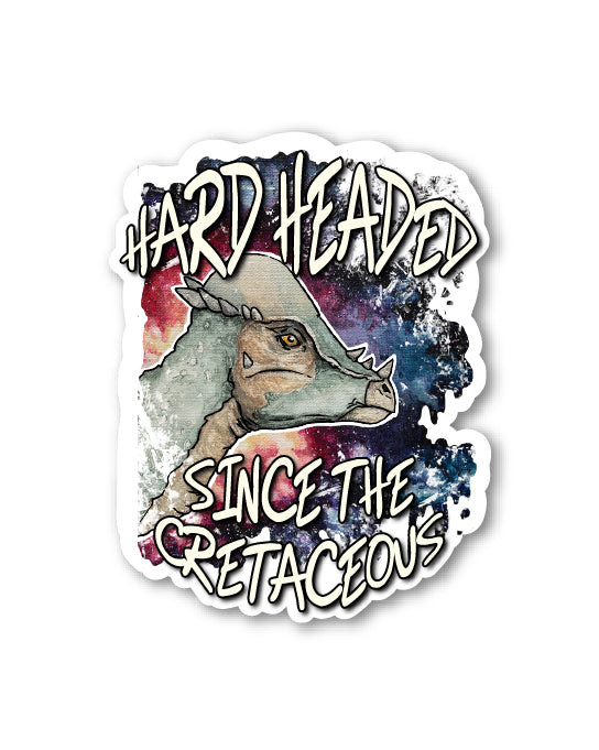 Sticker with dinosaur graphic and text 'Hard Headed Since the Cretaceous’ on a white background