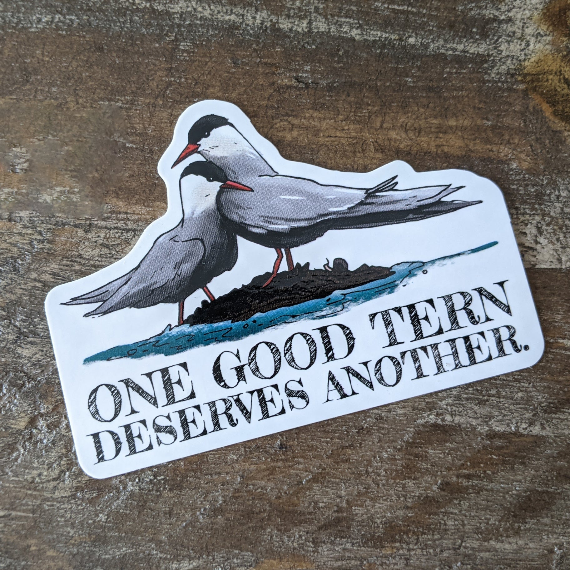 A vinyl decal with a hand-illustrated design of two tern birds and the pun 'one good Tern deserves another'.